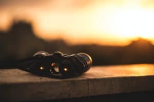 black compact binoculars in the sunset